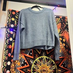 A blue small American Eagle sweater it is old but never worn